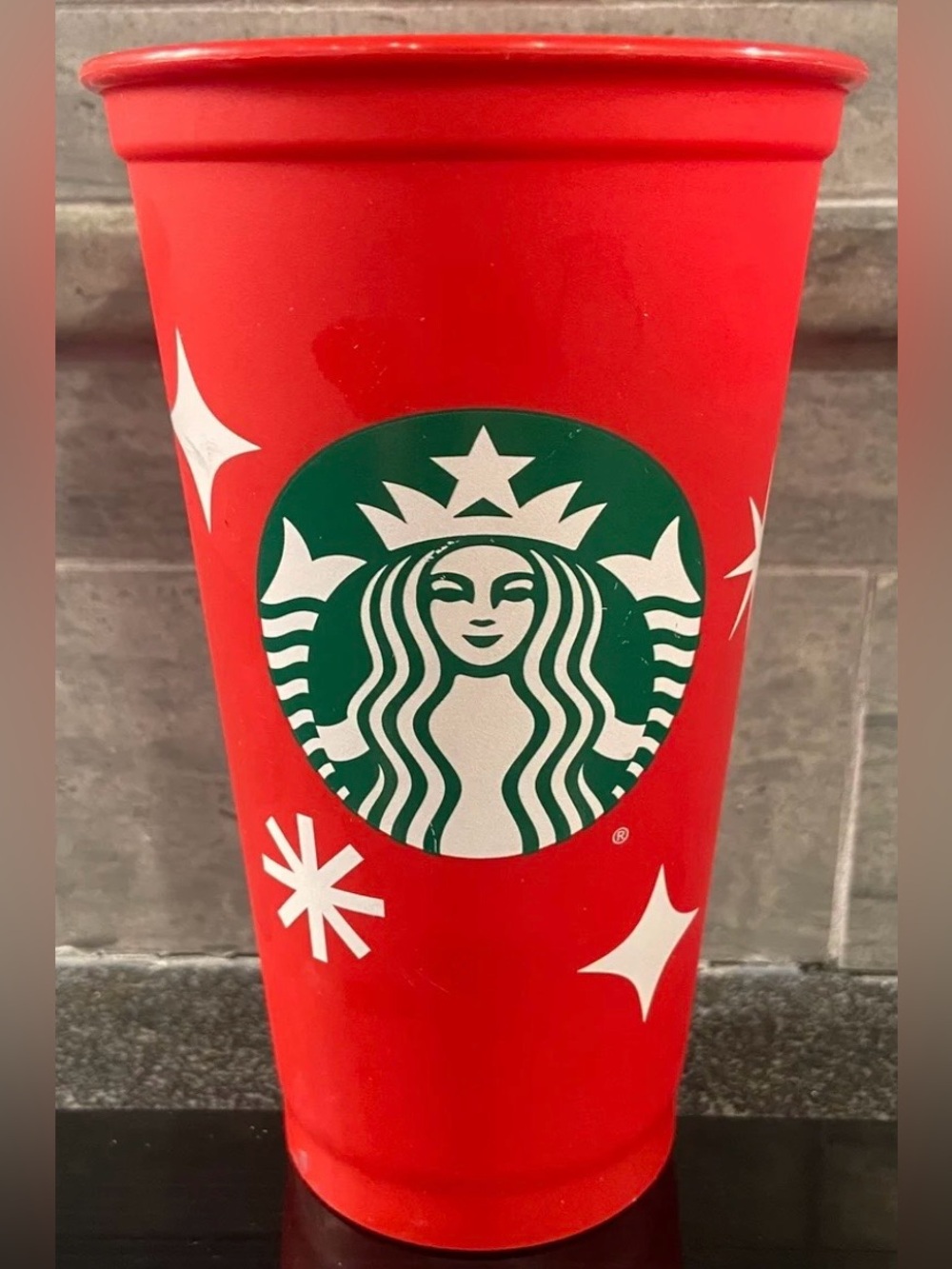 Starbucks Red Cup with Green Logo and White Stars